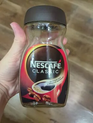 Nescafé® Classic. Натуральный растворимый порошкообразный кофе с добавлением натурального жареного молотого кофе.